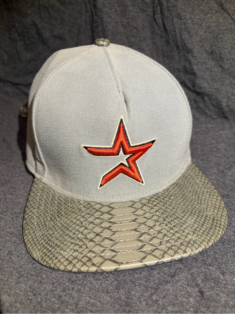 New Era Gray Snapback Hat with Orange Star Patch and Textured Brim
